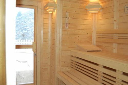 a wooden room with a sauna with a window at Anitas Ferienhaus in Cochem