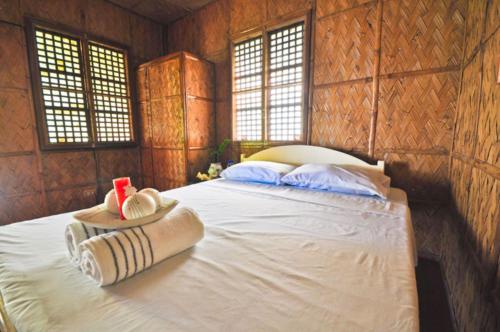 Tempat tidur dalam kamar di Villa de Pico Highland Beach Resort