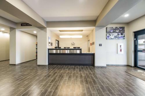 an empty lobby of a hospital with a counter at Sleep Inn Baxley in Baxley