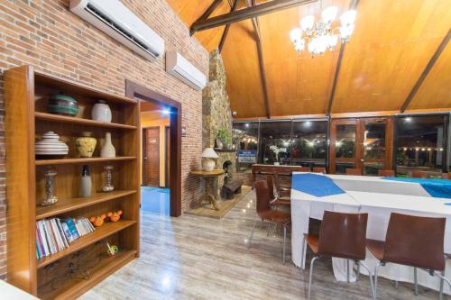 a kitchen and dining room with a table and chairs at RedDoorz Plus @ Starhomes Olivianville in Tarlac