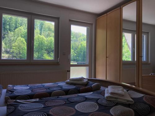 Postel nebo postele na pokoji v ubytování Ferienhaus am Wald