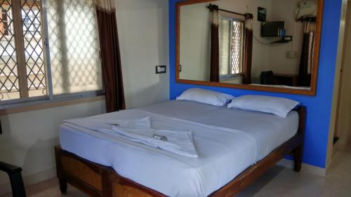 Postel nebo postele na pokoji v ubytování Rocky Guesthouse
