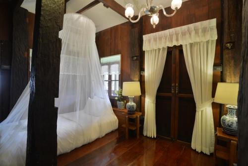 Katil atau katil-katil dalam bilik di Chantra Khiri Chalet Chiang Mai
