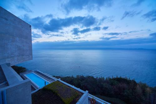 a view of the ocean from a house at TOTO Seawind Awaji in Awaji