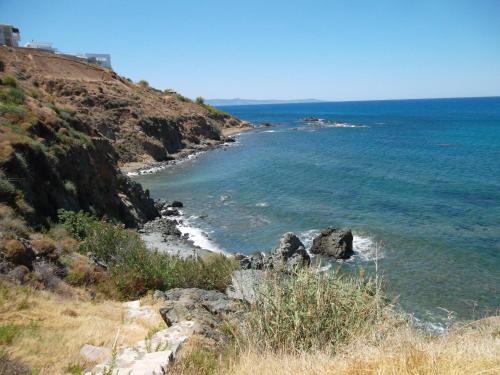 a view of the ocean from a hill at Beach Villa Pantheon in Pomos