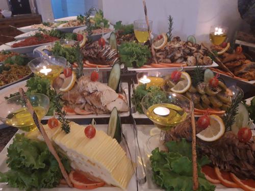 a buffet of different types of food on a table at Club Turtas Beach - All Inclusive in Konaklı