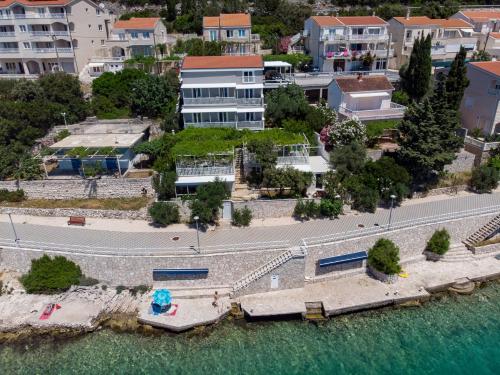 an aerial view of a city with buildings and water at Apartments Lukrecia in Neum