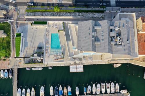 an aerial view of a marina with boats parked at Mosella Suite Hotel in Sottomarina