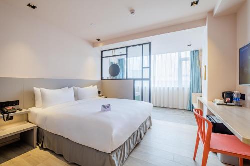 Ліжко або ліжка в номері PACE HOTEL Suzhou Guanqian Branch