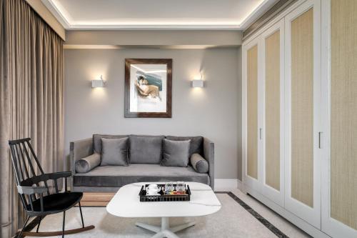 a living room with a couch and a table at Athenian Foss in Athens
