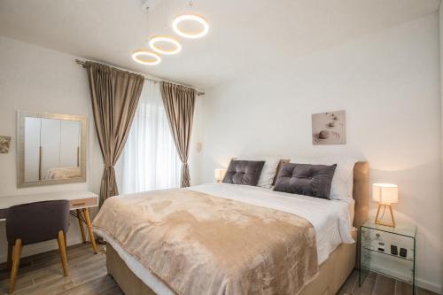 Ένα ή περισσότερα κρεβάτια σε δωμάτιο στο Apartment Dioclessima