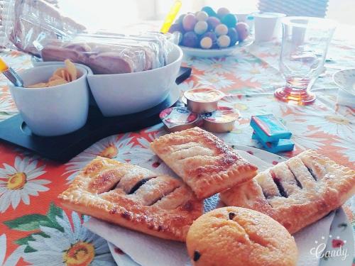 a table with a plate of bread and pastries on it at Il Borgo & il Feudo in Badolato
