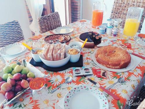 a table with a table cloth with food on it at Il Borgo & il Feudo in Badolato