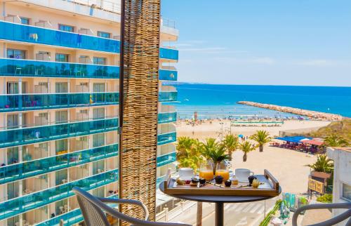 a view of the beach from the balcony of a hotel at Golden Costa Salou - Adults Only 4* Sup in Salou