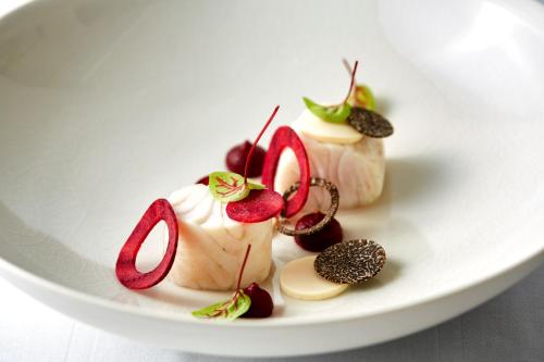 a plate of desserts on a white plate at Grand Hotel Wien in Vienna