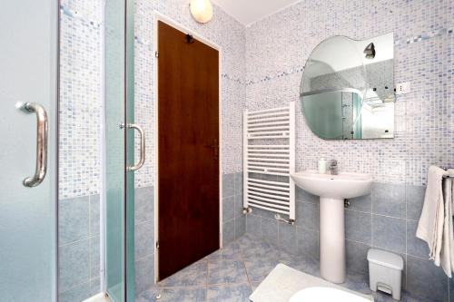 a bathroom with a sink and a mirror at Villa Carolina in Vabriga