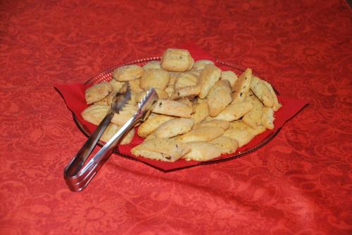 a plate of cookies on a red table at Hotel Giardino delle Palme in Campese