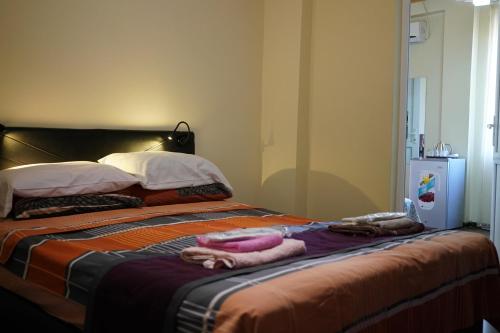 Postel nebo postele na pokoji v ubytování Ponto Hotel