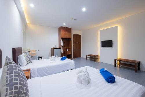 Katil atau katil-katil dalam bilik di Blue Beach Apartment