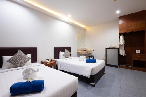 Katil atau katil-katil dalam bilik di Blue Beach Apartment