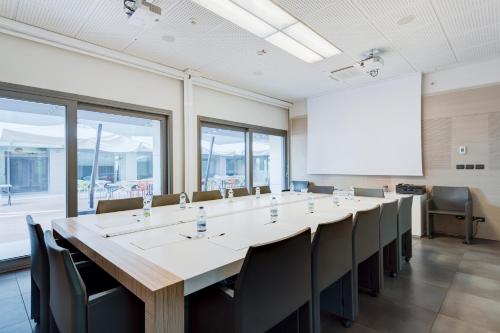 a large conference room with a long table and chairs at Camplus Bononia Casa per Ferie in Bologna