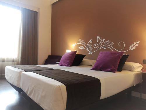 Katil atau katil-katil dalam bilik di Hotel Teruel Plaza
