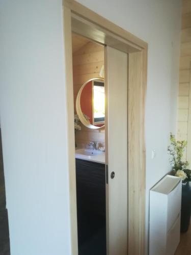 a bathroom with a sink and a mirror at CAMPO DE SOBARBO - Guest House rural in Penafiel
