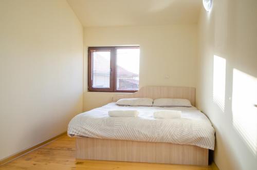 Ένα ή περισσότερα κρεβάτια σε δωμάτιο στο Guest House Vasilena Самостоятелно наемане FREE PARKING