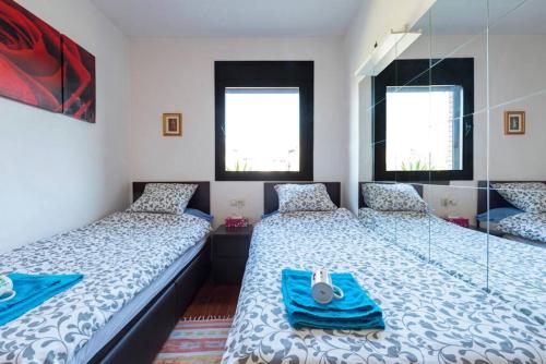 Postel nebo postele na pokoji v ubytování Jie Apartment