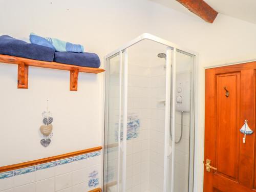 a bathroom with a shower and a glass shower stall at Lighthouse in Penzance