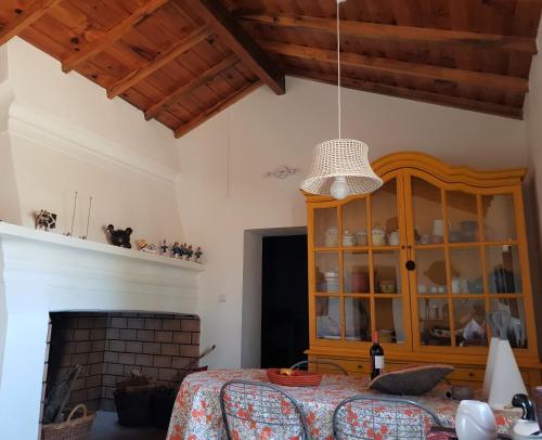 a bedroom with a bed and a wooden cabinet at Monte da Clareira - Comporta Carvalhal Melides in Grândola