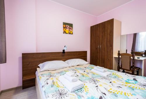 Ένα ή περισσότερα κρεβάτια σε δωμάτιο στο Alex apartment