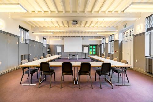 a large conference room with a large table and chairs at Domaine de Ronchinne - Château et Ecuries in Maillen