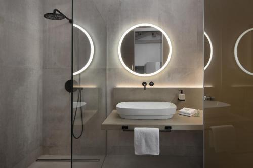 a bathroom with a sink and a mirror at Luxury Town House Corto Bechera in Bale