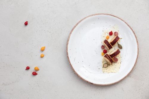 a white plate with some food on a table at Mitsis Summer Palace in Kardamaina