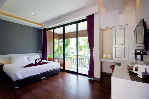 Katil atau katil-katil dalam bilik di Balcony Villa