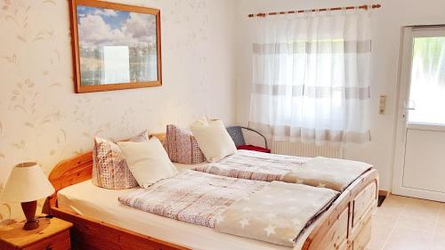 Postel nebo postele na pokoji v ubytování Ferienzimmer *Auszeit*