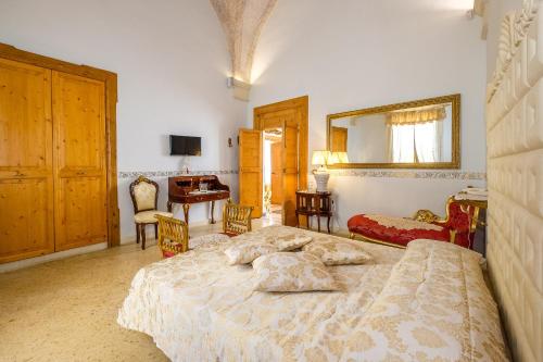 Palazzo Gallo Resort tesisinde bir odada yatak veya yataklar