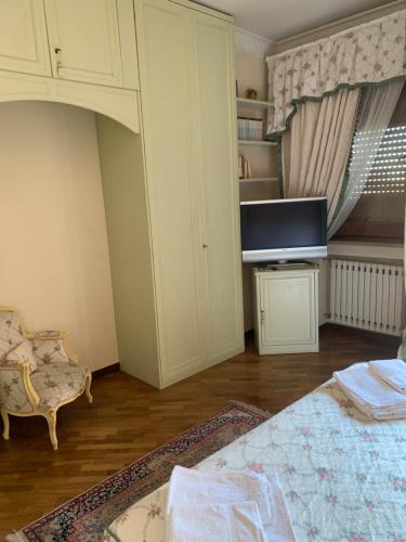 a living room with a couch and a tv at I Citri in Taranto
