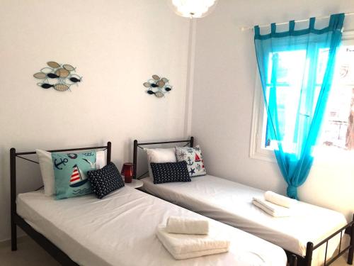 Postel nebo postele na pokoji v ubytování Cozy & comfy Apt with Sea View in Chora Andros