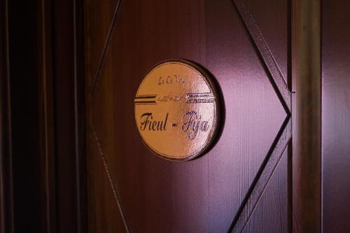 a sign on a purple door with the words love final step at Agriturismo La Cà Veja in Monforte dʼAlba