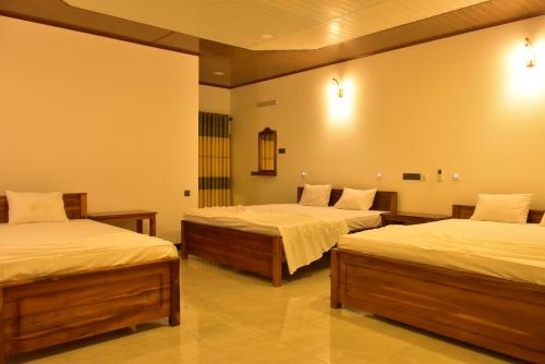 Säng eller sängar i ett rum på Ceylon Safari Cottage