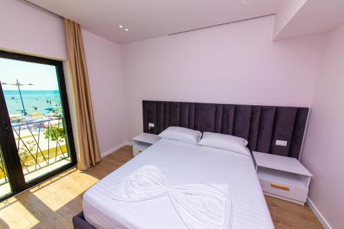 Postel nebo postele na pokoji v ubytování Hotel Alion
