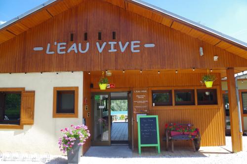 a building with a sign that reads leva vive at Eau Vive in Lescheraines