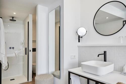 a white bathroom with a sink and a mirror at HM Dunas Blancas in Playa de Palma