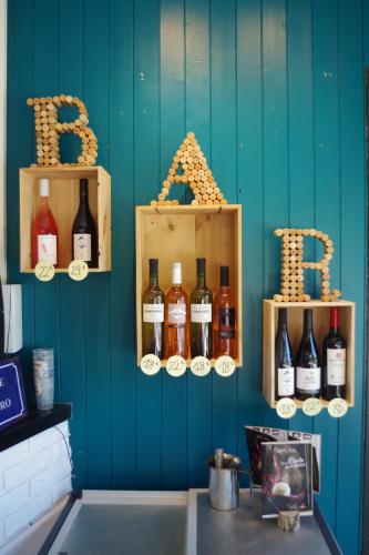 a bunch of bottles of wine on a wall at Eau Vive in Lescheraines