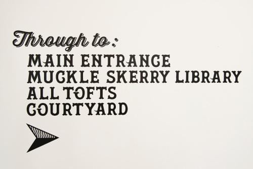 a calligraphy inscription through to main entrance muddy sterling library allothsguild at John O'Groats in John O Groats