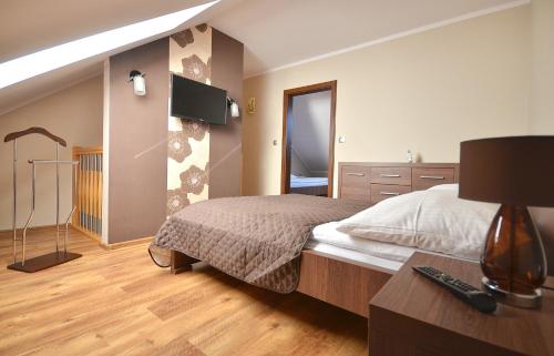 Кровать или кровати в номере Apartamenty Gaja