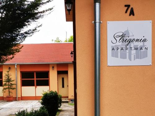 a sign on the side of a building at Strigonia Apartman in Esztergom