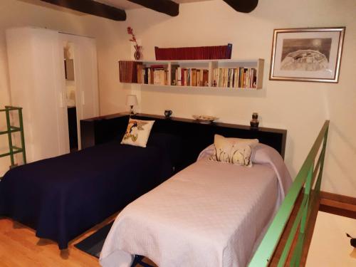 a bedroom with a bed and a book shelf at B&B Il Nespolo in Salerno